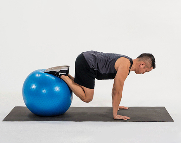 take-your-planks-to-the-next-level-with-the-stability-ball-knee-tuck